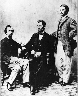 President Abraham Lincoln and his two secretaries, John Nicolay (left) and John Hay (right)